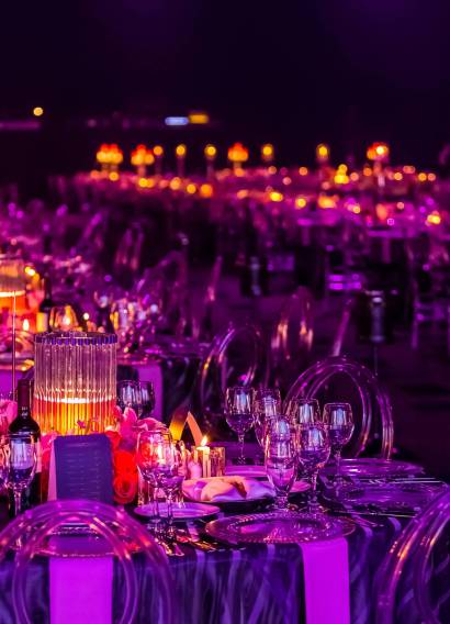 A gala dinner preparation, tables decorated with candles